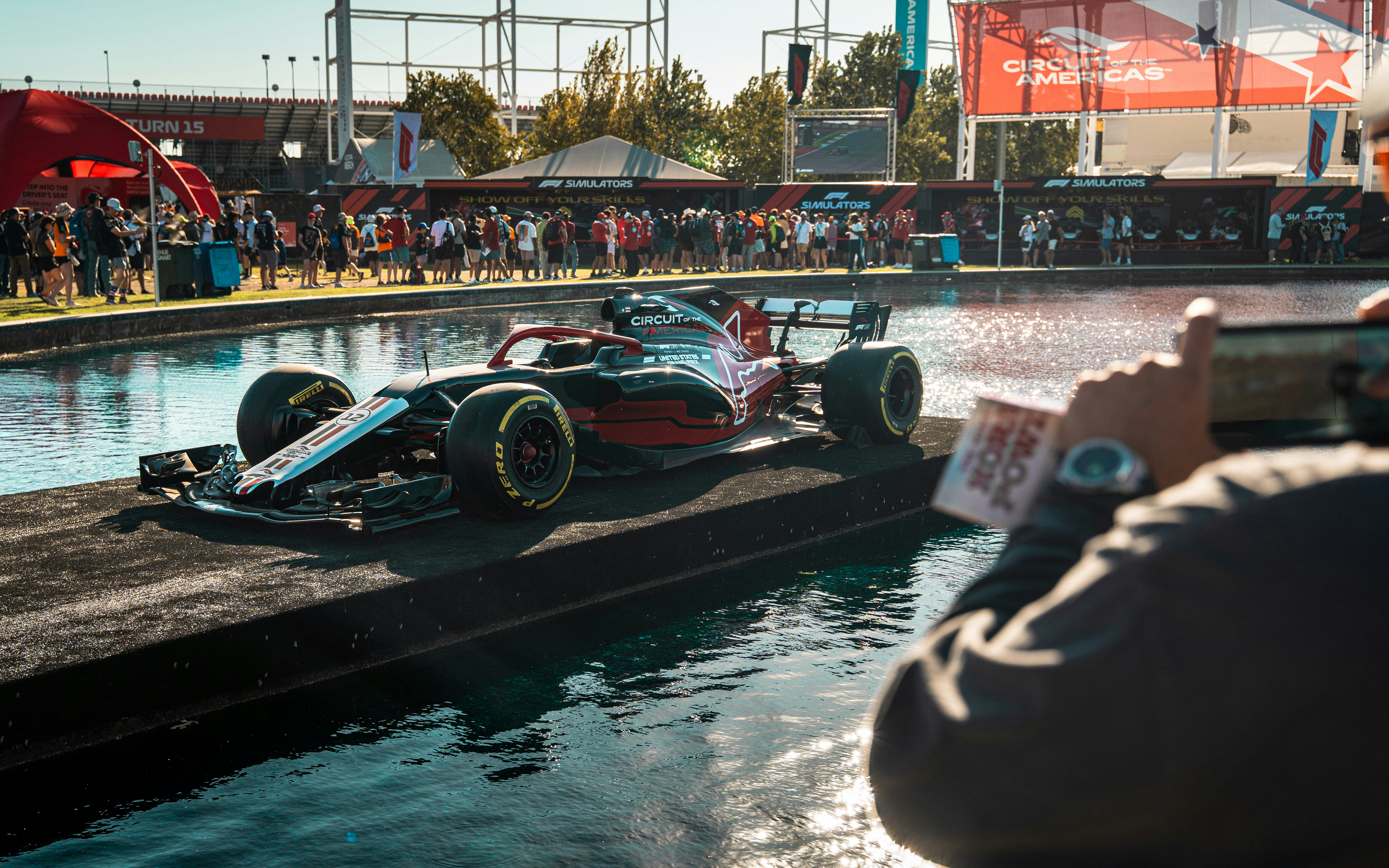 Formula 1 car driving on a wet track
