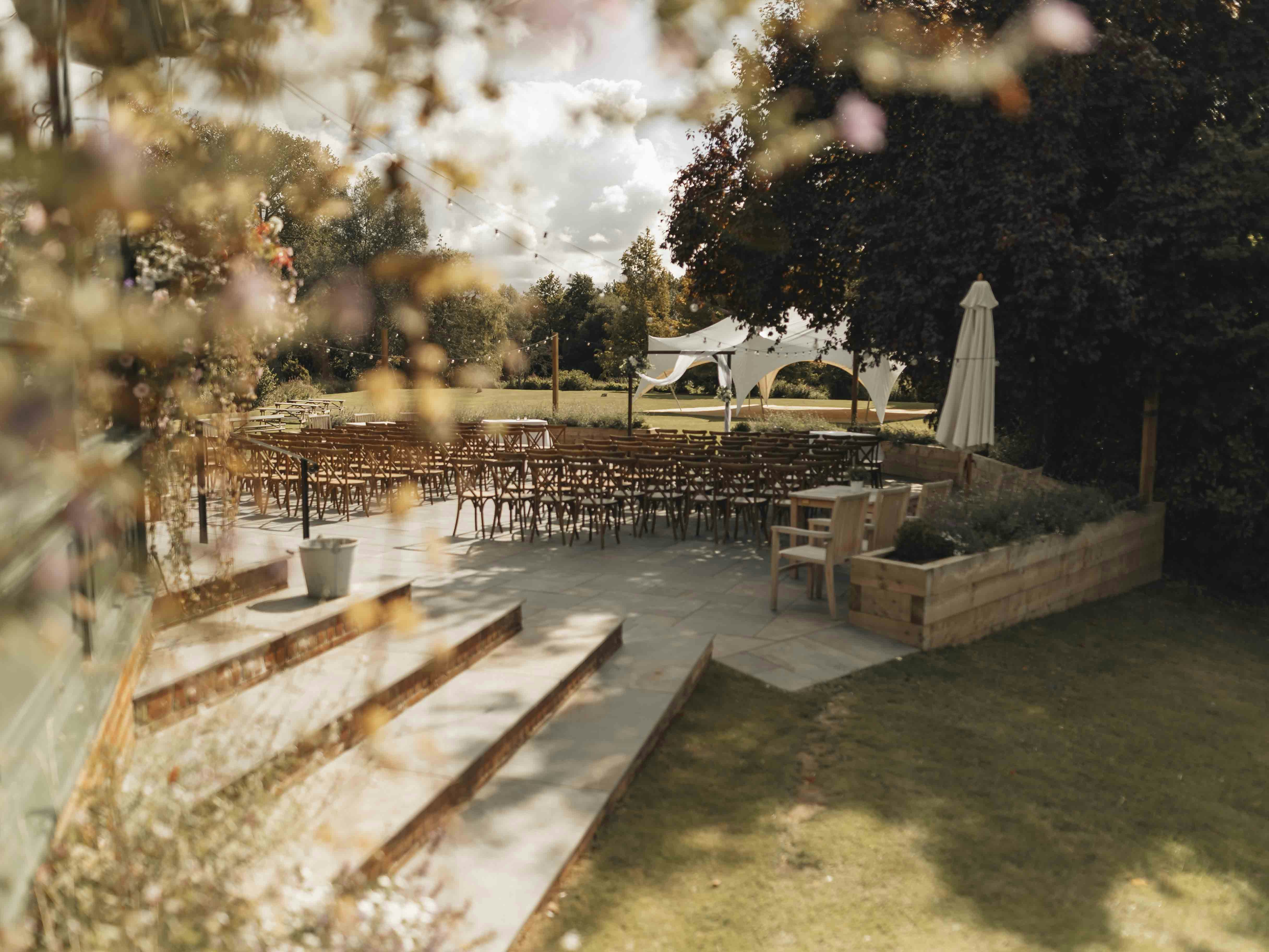 A view of an outdoor wedding venue from a window