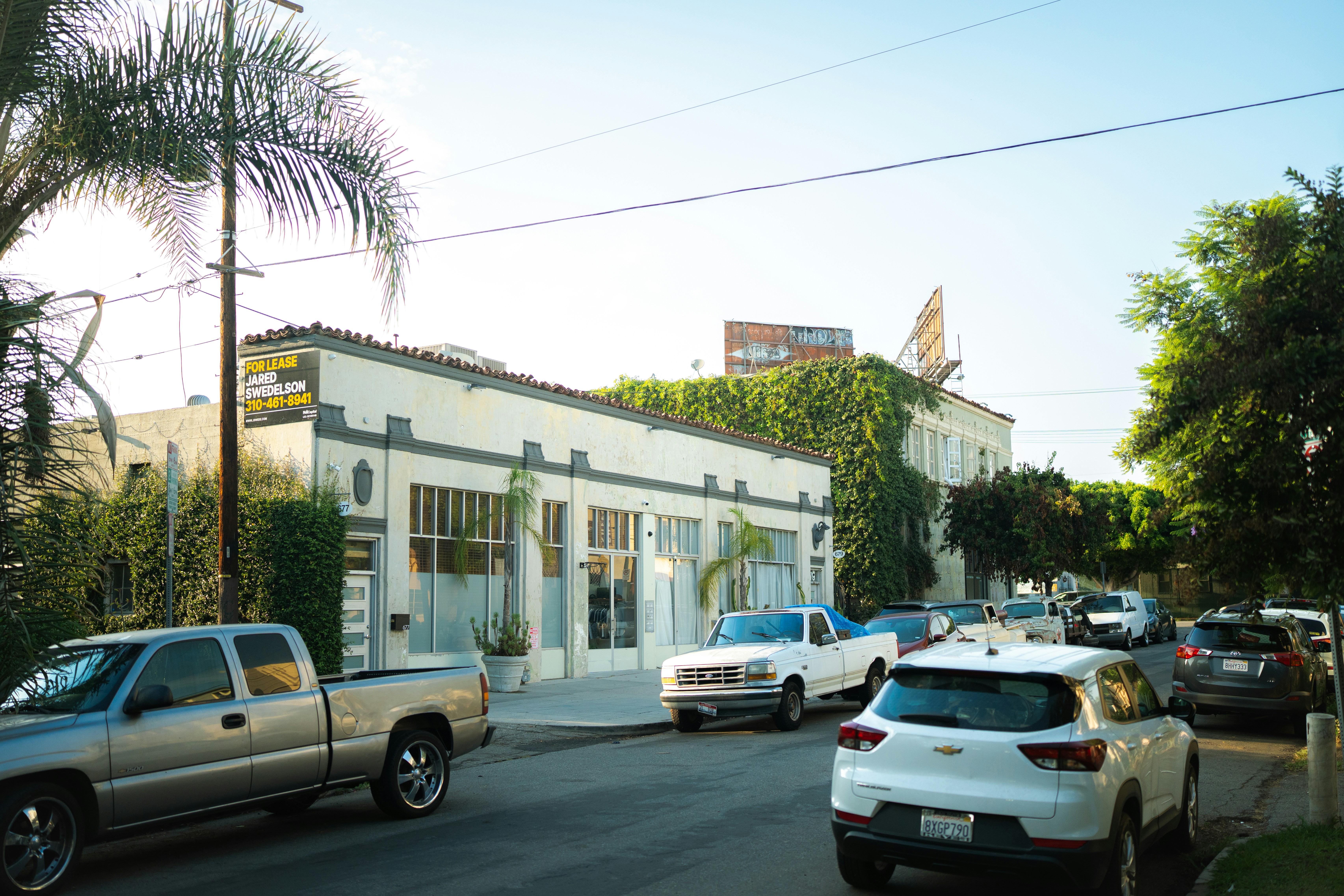 Cars parked on a street next to buildings